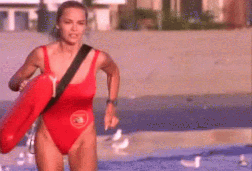 Pamela Anderson (I think), running to save someone on BAYWATCH!