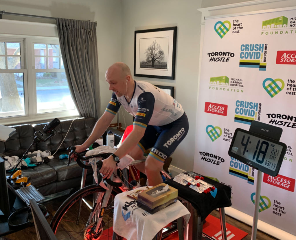 Toronto city councilor Brad Bradford in hour 9 of 24 hours of indoor cycling for a CRUSH COVID fundraiser.