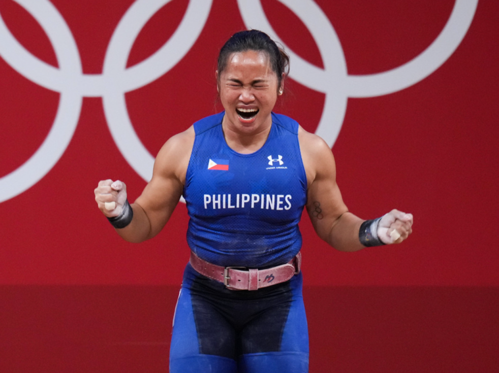 Hidilyn Diaz of the Philippines, expressing joy and victory at winning a gold medal in weight lifting.